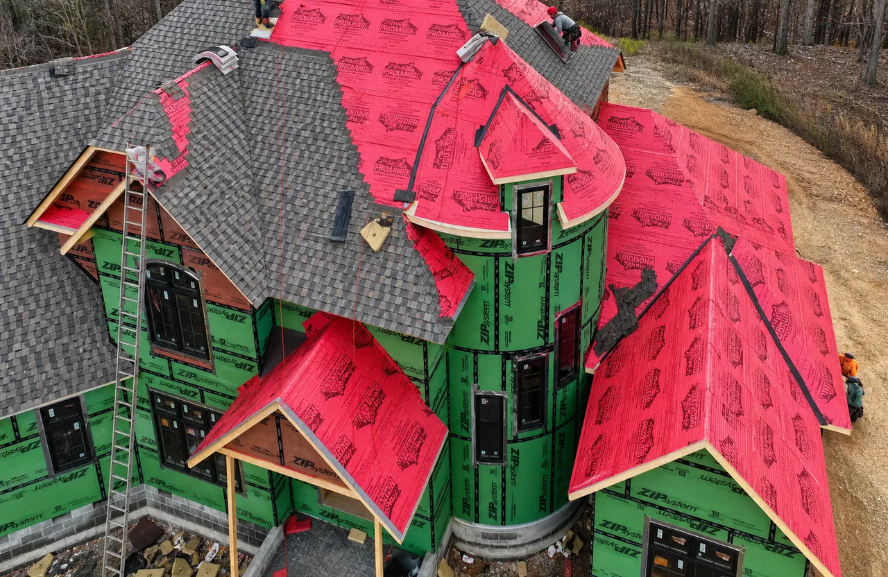 CAPS Roofing crew installing a new roof with premium underlayment