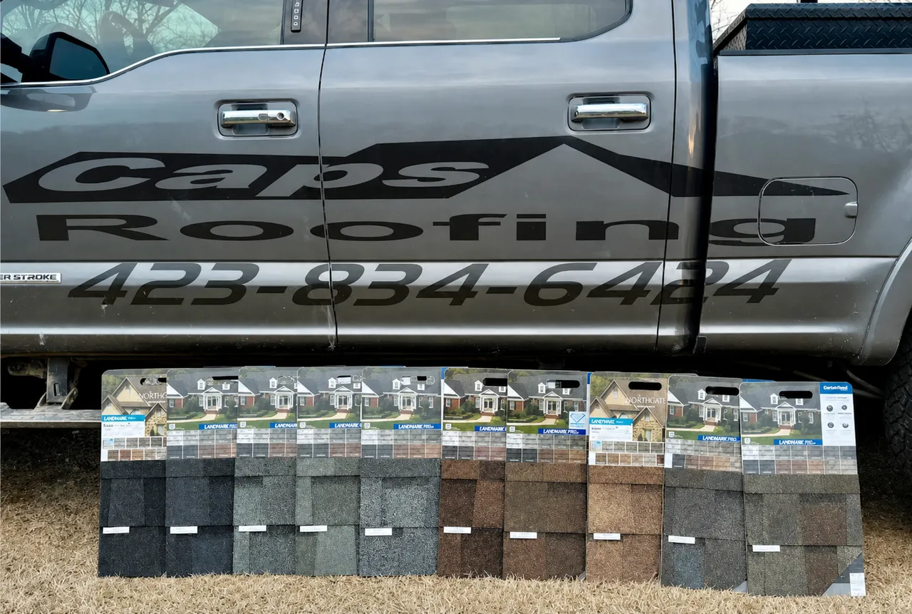 CAPS Roofing truck with shingle samples on a job site