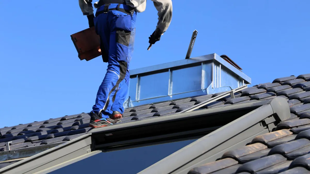 Professional roofing contractor at work