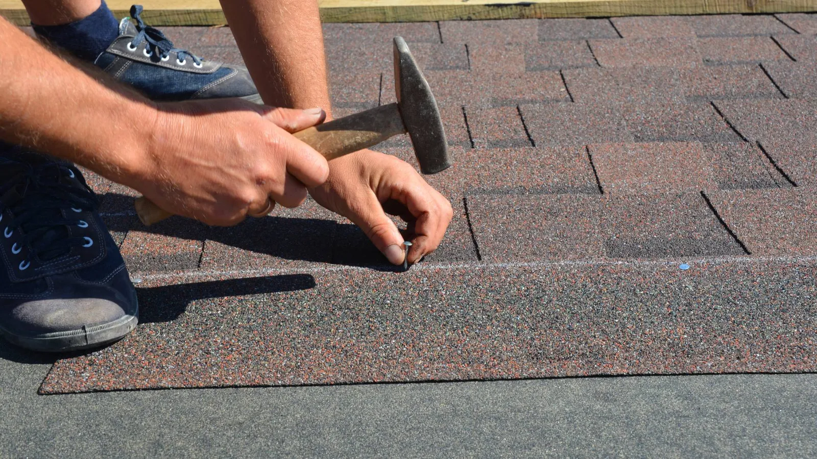 Roofing contractor installing shingles in South Pittsburg, TN